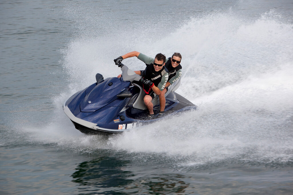 Man and woman riding wave runner on the Wisconsin River