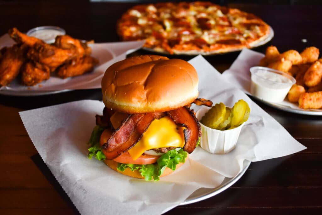 Chalet Burger with bacon and other happy hour appetizers