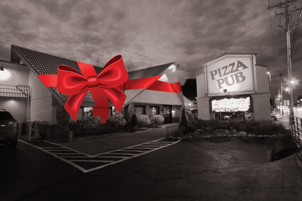 Pizza Pub exterior wrapped in big red bow