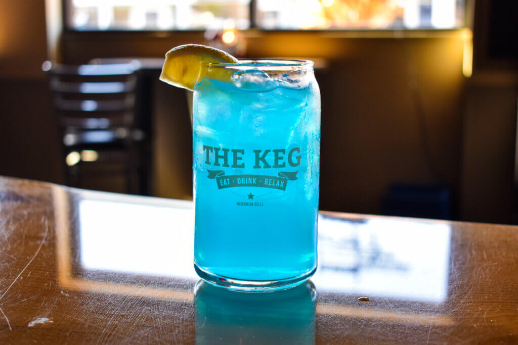 Blue cocktail with a lemon