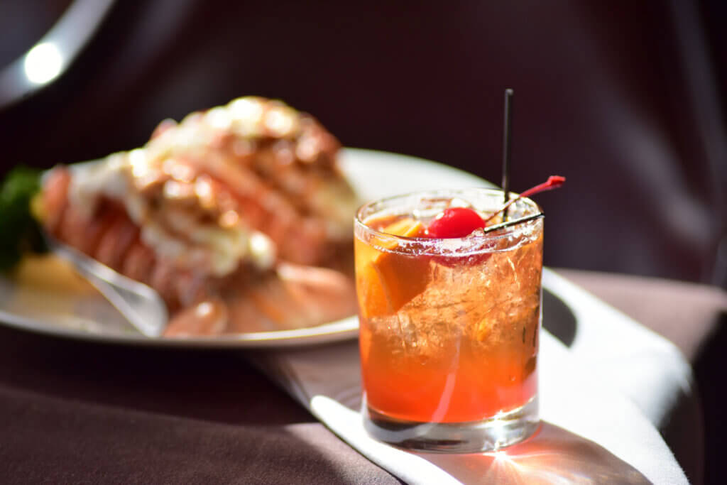 Old Fashioned on table in the sun at Dells supper club